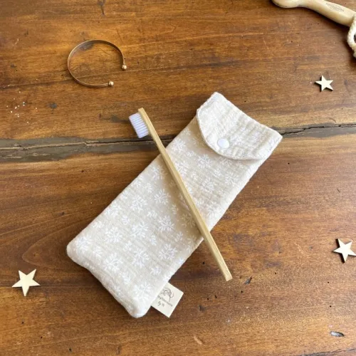 Pochette brosse à dents beige feuilles blanches