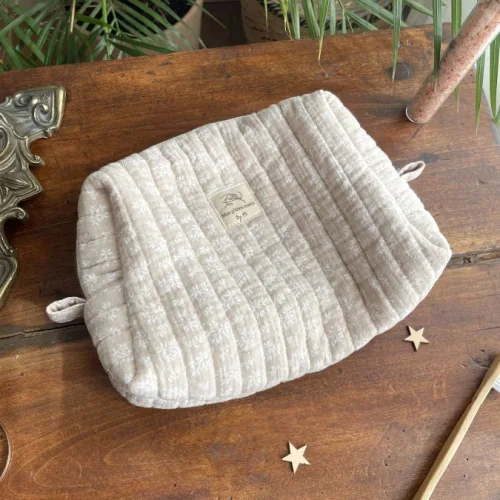Trousse de toilette beige feuilles blanches